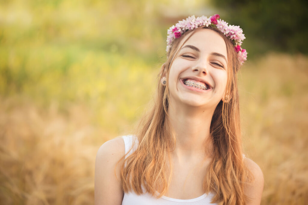 Young teen with braces enjoying the summer